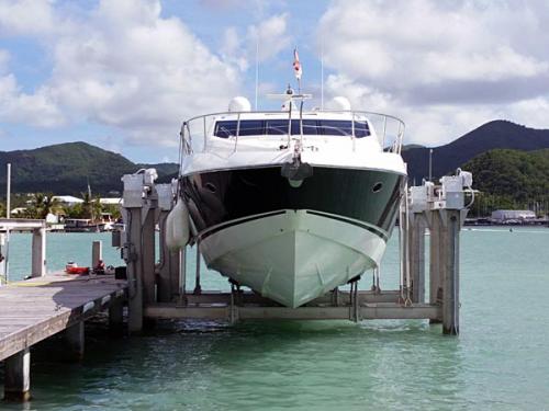 Front view of white and Black boat on an 120,000 pound 8-Post Boat Lift in Antigua.