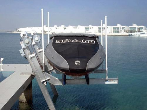 front angled view of 7,000 pound elevator lift holding covered boat