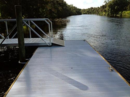 aluminum floating dock leading to boarding walkway