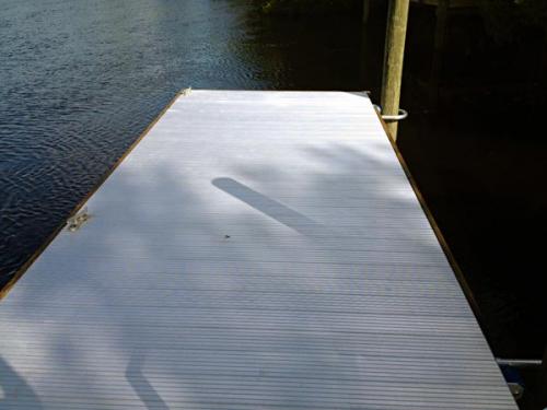 grey aluminum floating dock on water