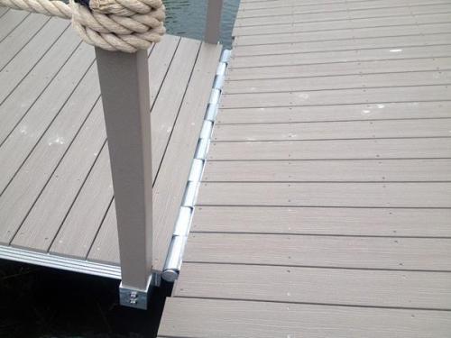 angled close up of hinge platform of aluminum floating dock