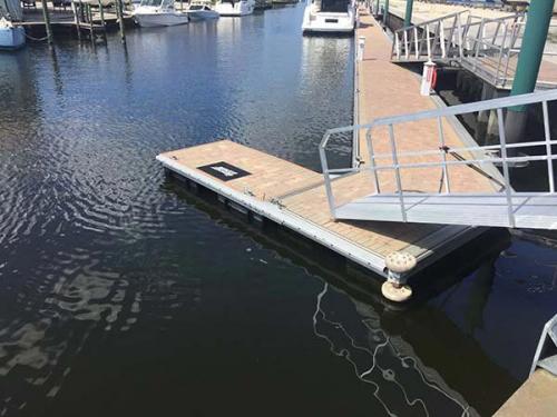 angled segment of aluminum floating dock on water